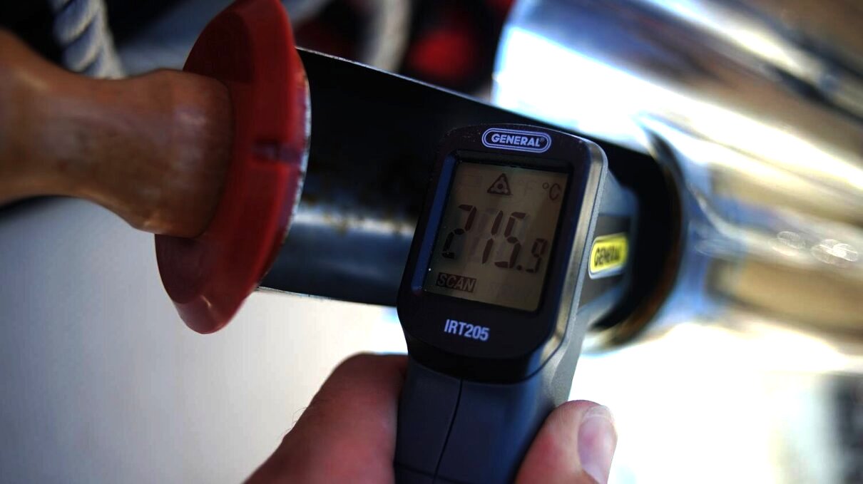 an electronic read-out of the temperature inside a solar cooker on a sunny day reading 216C/420F