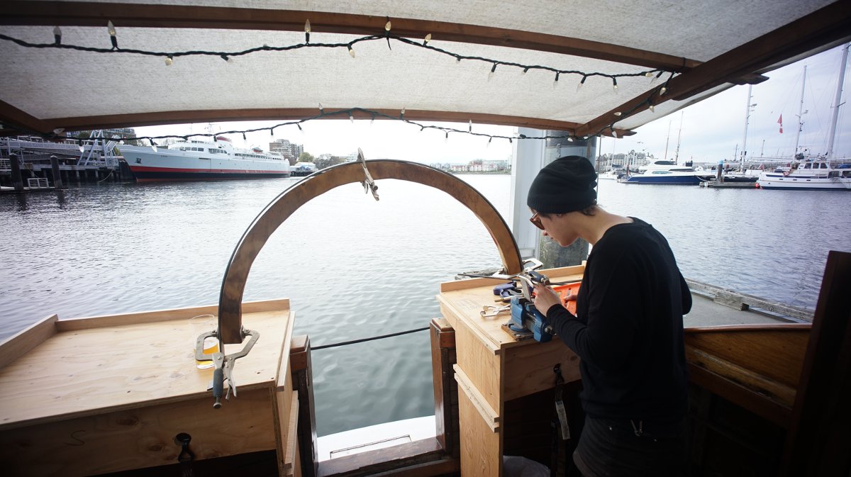 arch building on peters boat someone building a metal arch with a beautiful waterfront view ahead