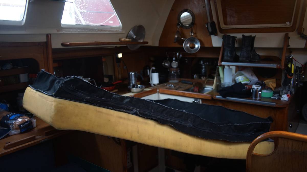 a trapezoid-shaped piece of foam with the cover laying overtop for a test fit