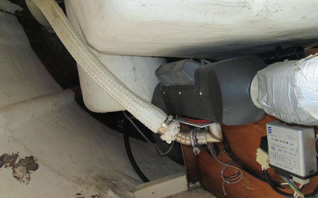 our old espar unit in a locker A photo of an espar diesel heating unit in the locker of a sailboat