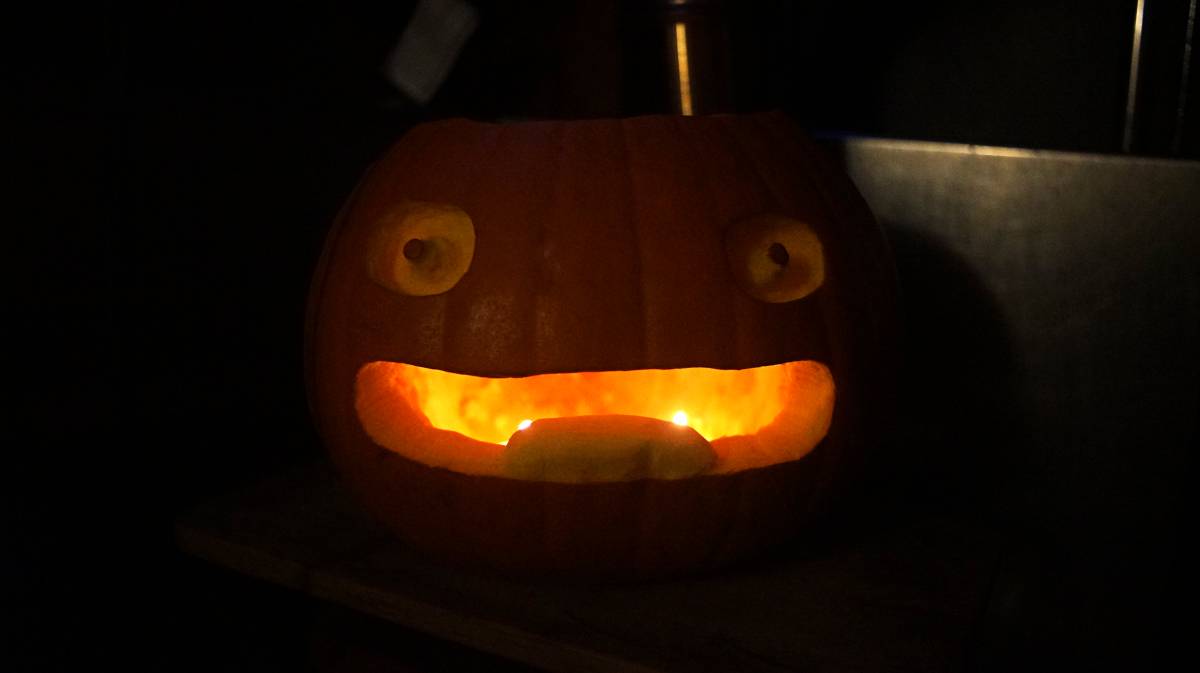 calcifer pumpkin A photo of calcifers face carved onto a pumpkin