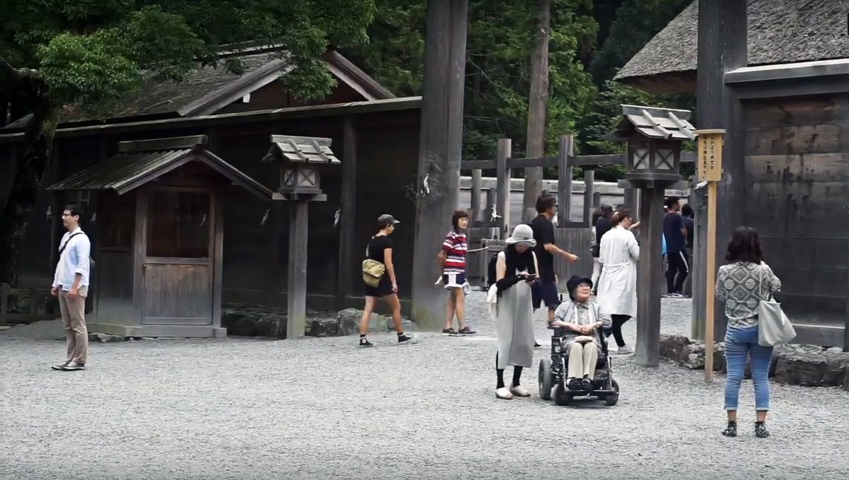 going to visit a shrine rek and tourists go try and catch a glimpse of the shrine