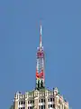 An antenna tower 146 feet (45&nbsp;m) tall in San Antonio, TX with its red and white aircraft warning paint visible