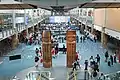 "Musqueam welcome figures" by Susan A. Point in the International Arrivals hall of Vancouver International Airport