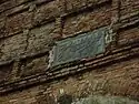 The Arabian inscription that says: "Muhammad, the Arabian, is glory of both worlds. Dust be on the head of him who is not the dust of his portal".