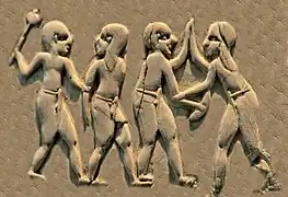 Shaven-headed attackers armed with maces and knives, against unarmed opponents with long hair, all wearing penile sheaths (Front, 1st register).