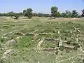 Bhir Mound, houses (center) and main street (left)