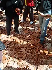 Image 28Shards of pottery vases on the street, after being thrown from the windows of nearby houses. A Holy Saturday tradition in Corfu. (from Culture of Greece)