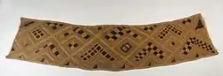 Cloth; raffia; 20.3 x 85.7&nbsp;cm (8 x 333⁄4 in.); Brooklyn Museum. In Kuba culture, men are responsible for raffia palm cultivation and the weaving of raffia cloth. Several types of raffia cloth are produced for different purposes, the most common form of which is a plain woven cloth that is used as the foundation for decorated textile production