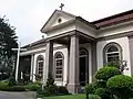 The south side entrance in the form of a diminutive portico.