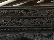 small dragon with curvy shapes around it