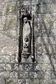 Carving on the south face of the tower of St Nicholas church in Durweston, Dorset, by Don&nbsp;Potter (1991)