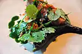 Fried bacon with ramsons and grilled cucumber