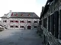 Store room and powder magazine (now Mars Education Center); soldiers' barracks at right