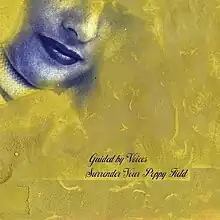 A golden painting with a blue mouth in the upper left corner