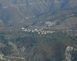 Krastë seen from the summit of Noi i Madh (1848 m), at a distance of 7.7 km (5 mi) as the crow flies.