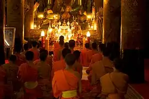 Image 11Monks gathered at evening prayer (from Culture of Laos)