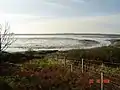 Looking west across the loch to the Rinns at low tide