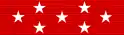 Red ribbon with seven white stars: a row of three stars across the center, and rows of two stars above and below