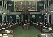 The Legislative Assembly seating in 1936. The crucifix, seen above the rostrum of the Speaker, was installed on October 7, 1936, and stayed there for almost 83 years. Its presence sparked debate about secularism in Quebec, until the National Assembly passed a motion to remove it.