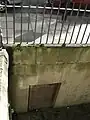 Coal hole and doorway under street