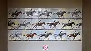 The station is decorated with jockeys on horses.