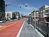 A bus stop in the median of an urban arterial