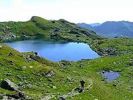 The Upper Wildalm Lake ({{Subst:Formatnum:2324}}&nbsp;m) just below the summit