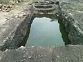 One of the 16 rockcut cisterns at Pavurallakonda Bheemili