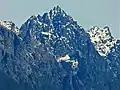 Merchant Peak centered, with the southeast subsidiary subpeak (5,831&nbsp;ft) to the right. The subpeak is mistakenly labelled as Merchant Peak on old USGS maps.