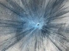 Fresh impact crater on Mars 3°42′N 53°24′E / 3.7°N 53.4°E / 3.7; 53.4 (November 19, 2013).