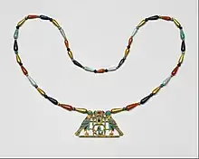 Pectoral and necklace of Princess Sithathoriunet; 1887–1813&nbsp;BC; gold, carnelian, lapis lazuli, turquoise, garnet & feldspar; height of the pectoral: 4.5&nbsp;cm; Metropolitan Museum of Art