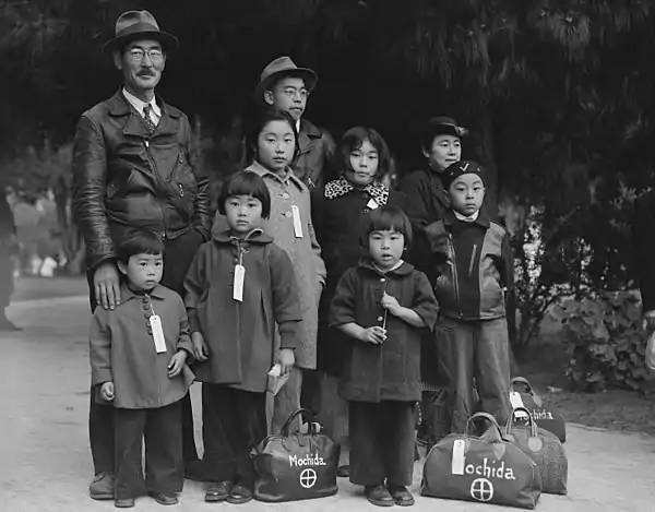 Image 3Internment of Japanese AmericansPhotograph: Dorothea Lange; Restoration: BammeskThe internment of Japanese Americans in the United States during World War II was the forced relocation and incarceration in concentration camps in the western interior of the country of between 110,000 and 120,000 people of Japanese ancestry, most of whom lived on the Pacific coast. Sixty-two percent of the internees were United States citizens. These actions were ordered by President Franklin D. Roosevelt shortly after Imperial Japan's attack on Pearl Harbor.This picture shows members of the Mochida family in Hayward, California, waiting for an evacuation bus to take them to an internment center.More selected pictures