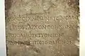 Inscription in the votive stele of Plutarch.
