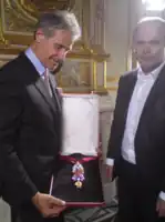 The recreated great Golden Fleece of King Louis XV of France, presented by H. Horovitz (left) and François Farges&nbsp;[fr] (right) at the Hôtel de la Marine, formerly the royal Storehouse in Paris, on June 30, 2010.