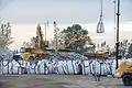 Rock being loaded into bags for transport by helicopter (upper right) to reinforce the emergency spillway (February 13)