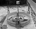 A NASA engineer takes a walk in simulated zero gravity around a mock-up of a full-scale, 7.3&nbsp;m (24&nbsp;ft) diameter space station in 1964.