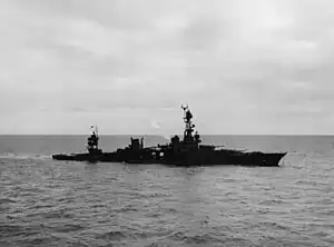 USS Chicago low in the water on the morning of January 30, 1943, from torpedo damage inflicted the night before