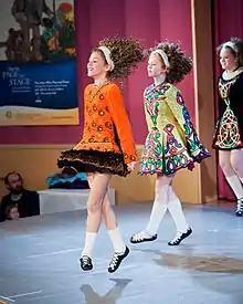 Image 8Irish dancers in Irish dancing costumes, which often feature lace or an embroidered pattern copied from the medieval Irish Book of Kells. (from Culture of Ireland)