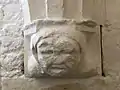 Corbel dating to the late 1200s of a woman wearing a wimple