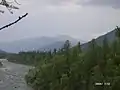 A river with the Ural Mountains in the background, Berezovsky, Khantia-Mansia, Russia Urals