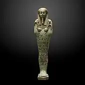 Ushabti; 360–343&nbsp;BC; ceramic and enamel; 26.7 × 7.1&nbsp;cm; from Saqqara; Museum of Art and History (Geneva, Switzerland)