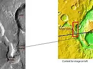 The long channel Nirgal Vallis is shown where it connects to Uzboi Vallis.  The crater Luki is 21&nbsp;km in diameter.  Picture taken by THEMIS.