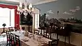 A dining hall with plates set