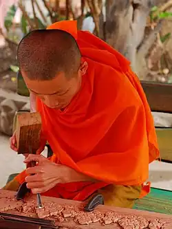 Image 36Lao monk woodworking temple details (from Culture of Laos)